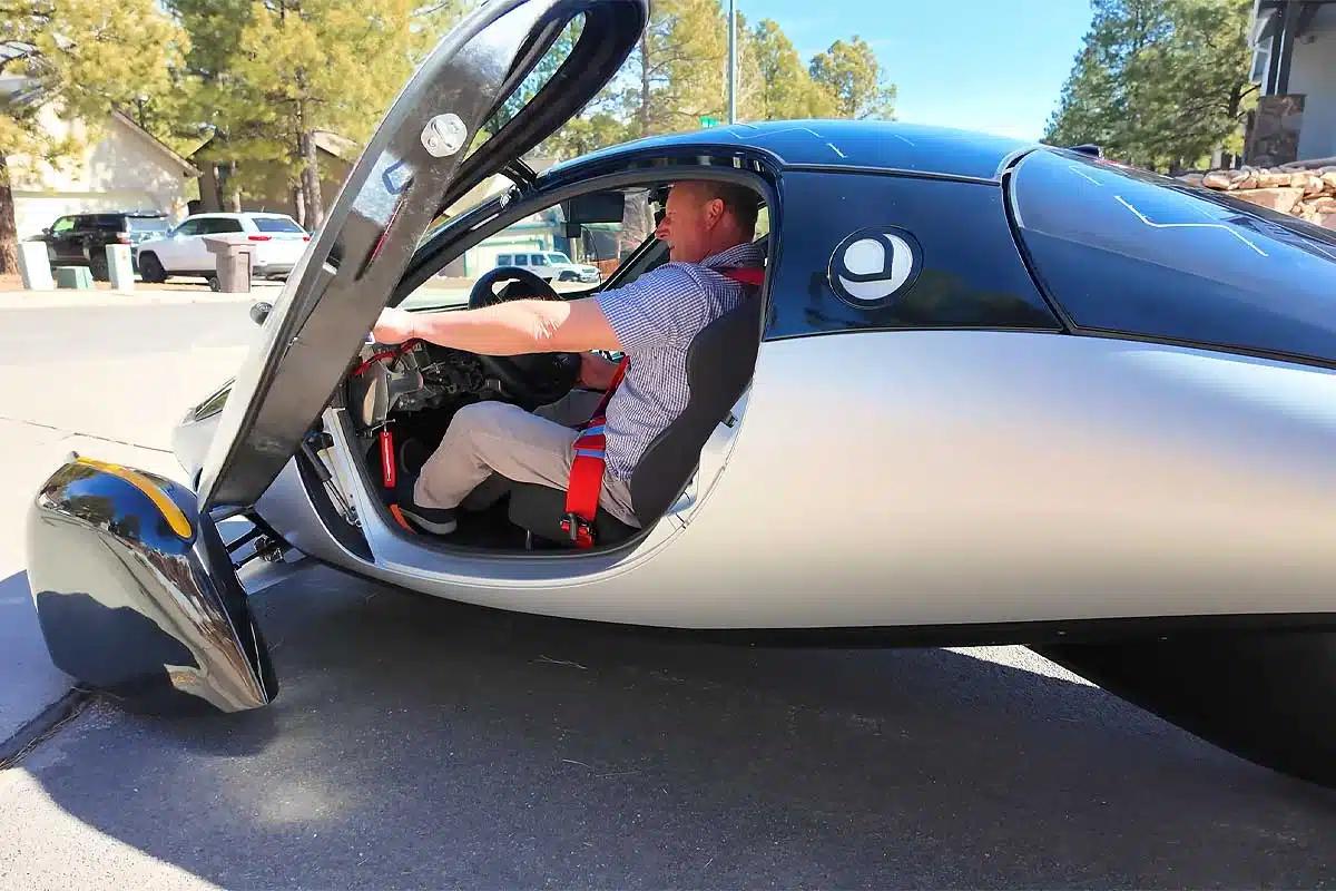 The Aptera features gullwing doors.