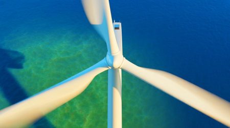 Illustration of the world's largest wind turbine unveiled in China, highlighting its massive scale and renewable energy potential.
